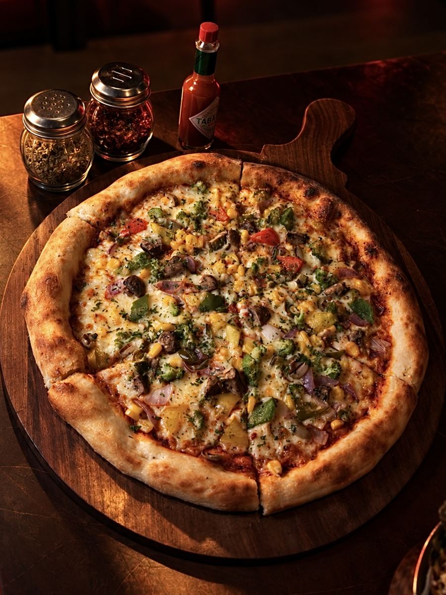 Wood-fired pizza on a board